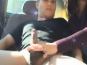 Asian milf sucking cock in car back seat