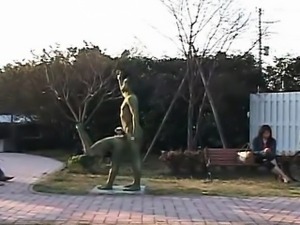 Subtitled Japanese woman painted to mimic park statue