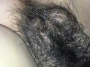 Unloading his cum on her hairy vagina