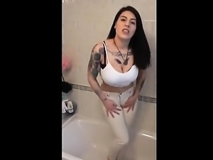 Busty woman pisses in trousers that are white