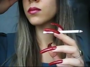 Sexy girl with extra long nails smoking seductively on webcam