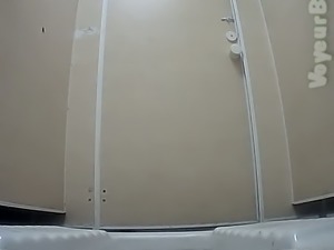 White chick in white coat filmed on voyeur camera in the restroom