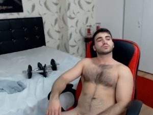 Hot muscular guy with a hairy body is masturbating for you