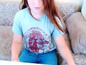 Busty teen redhead shows off on a webcam