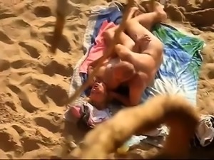 Beach voyeur shoots a horny mature couple having hot sex