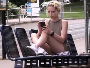 Pretty blonde teen exposes her tight slit in a public place