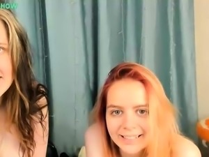 A redhead fucks a brunette in sexy lesbian porn