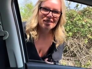 Big boobed cougar in heat gives hot handjob in the car
