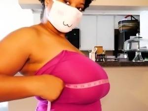 Big tittied ebony milf measuring her chest size on webcam