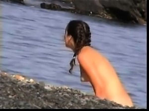 French amateur girl blows on a public beach